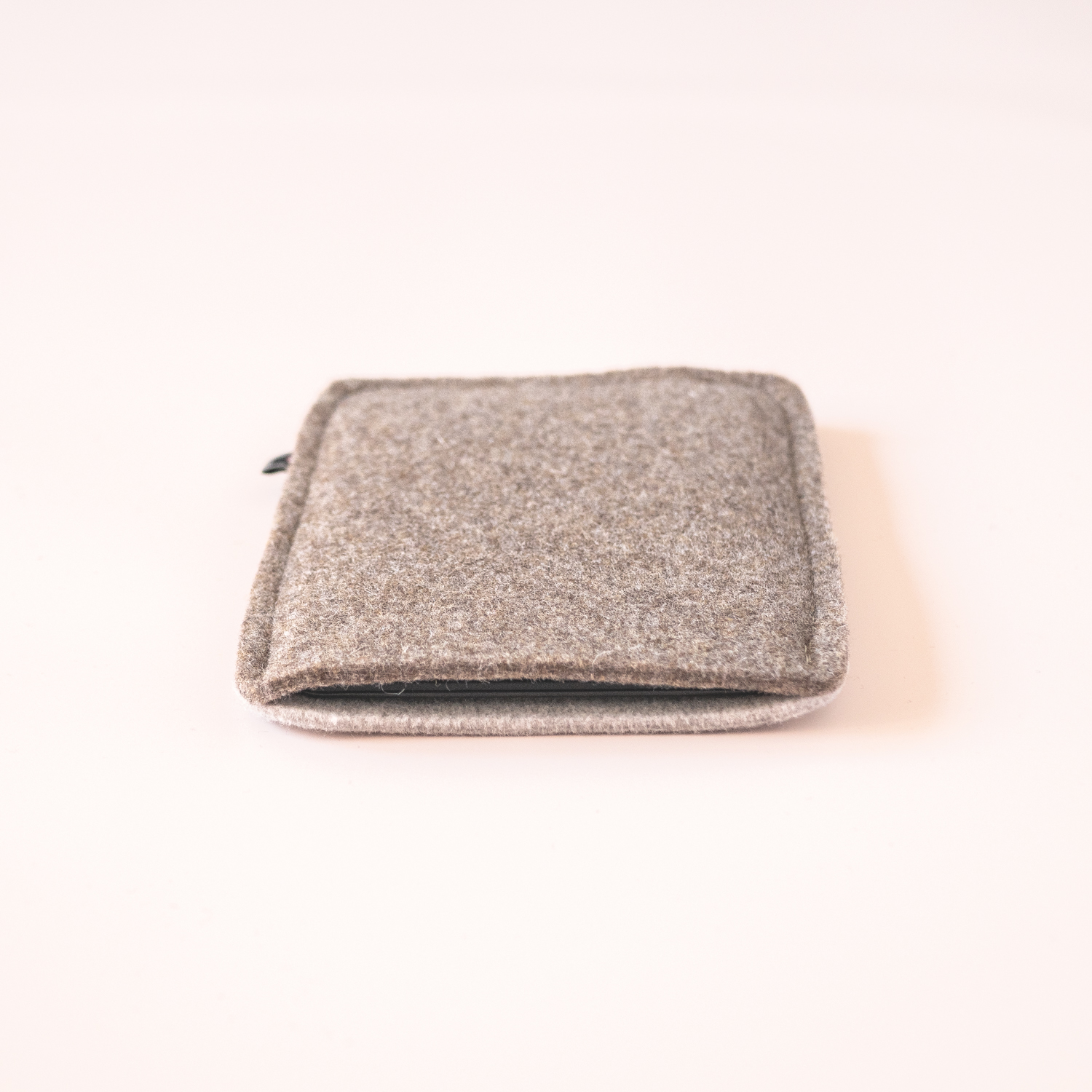 Kindle sleeve made of grayish brown and cream white wool felt