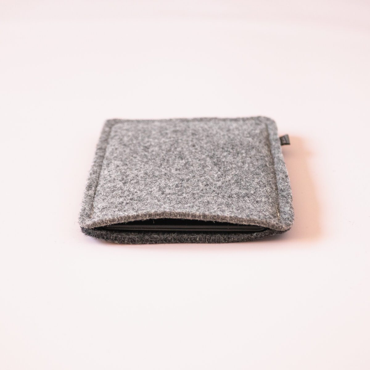 Kindle case made of black and dark gray wool felt