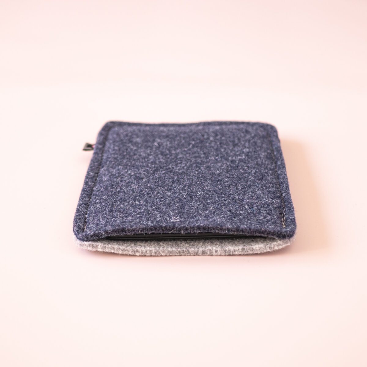 Kindle case made of navy blue and light gray wool felt