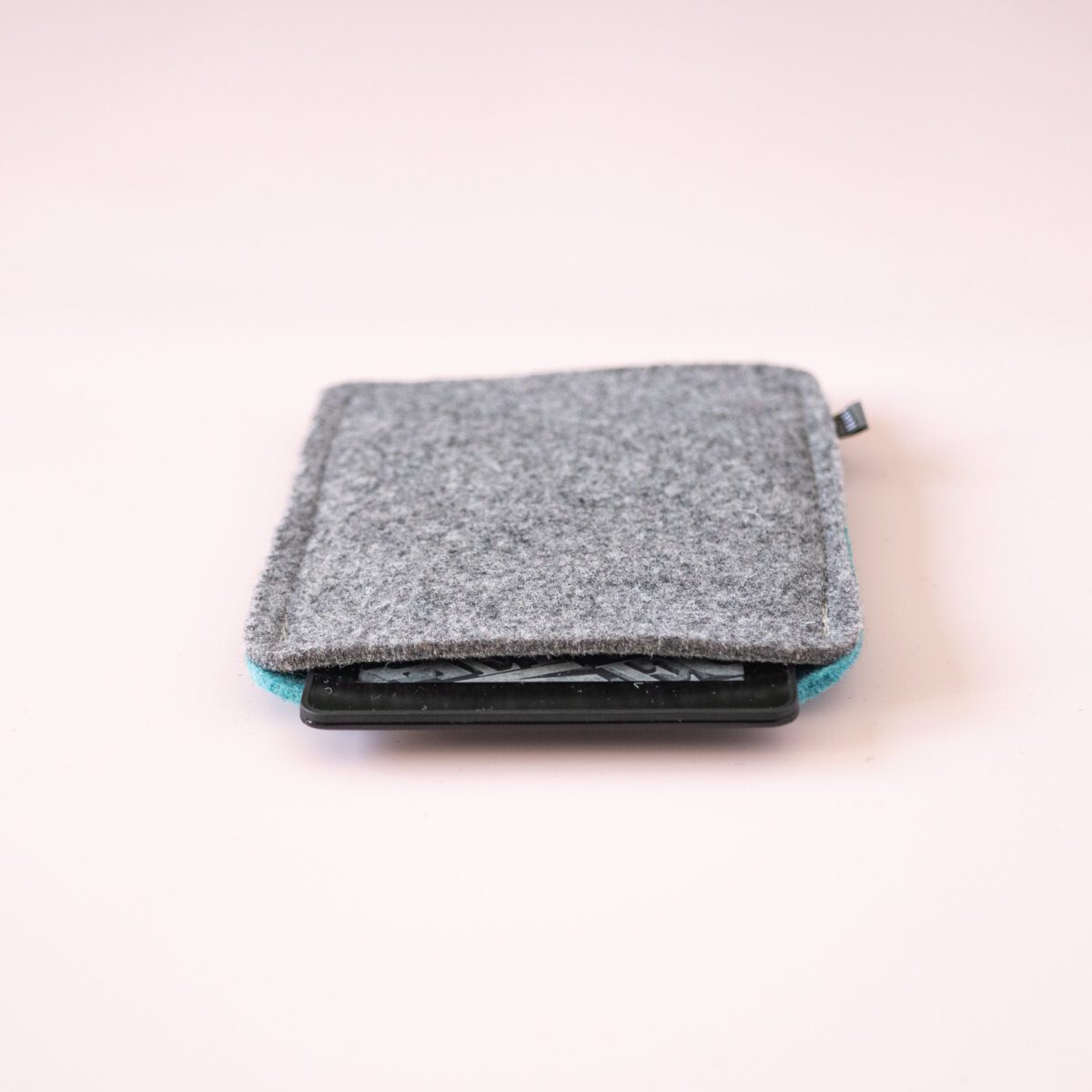 Kindle case made of turquoise blue and dark gray wool felt