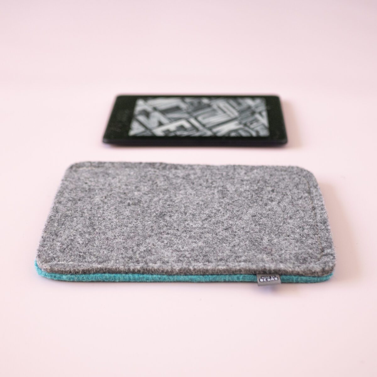 Kindle case made of turquoise blue and dark gray wool felt