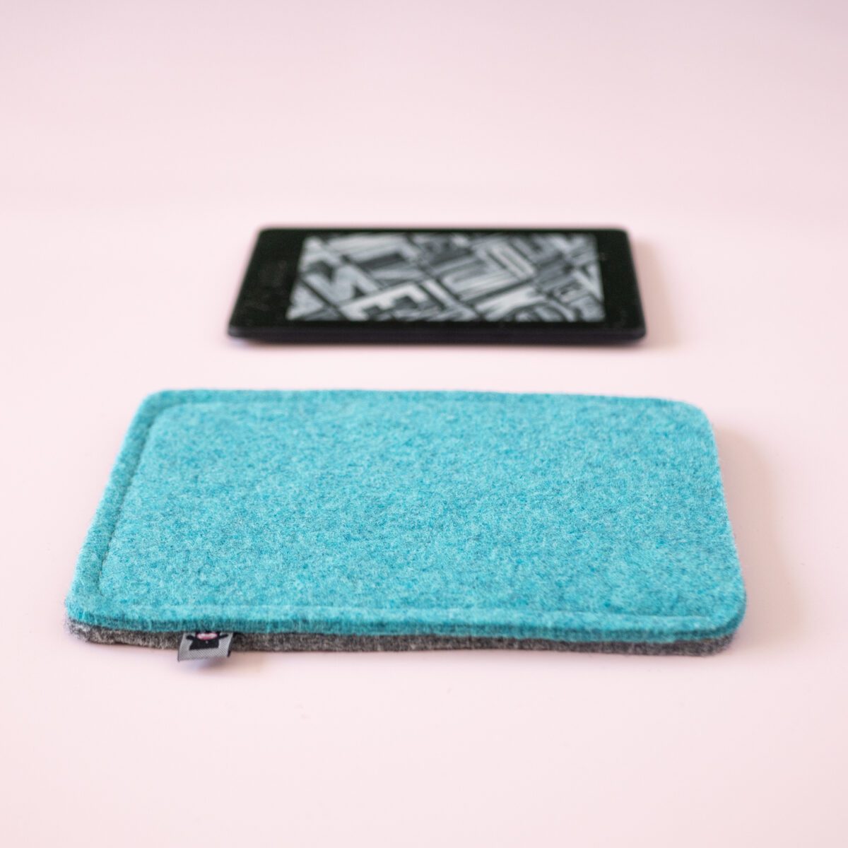 Kindle case made of turquoise blue and dark gray wool felt