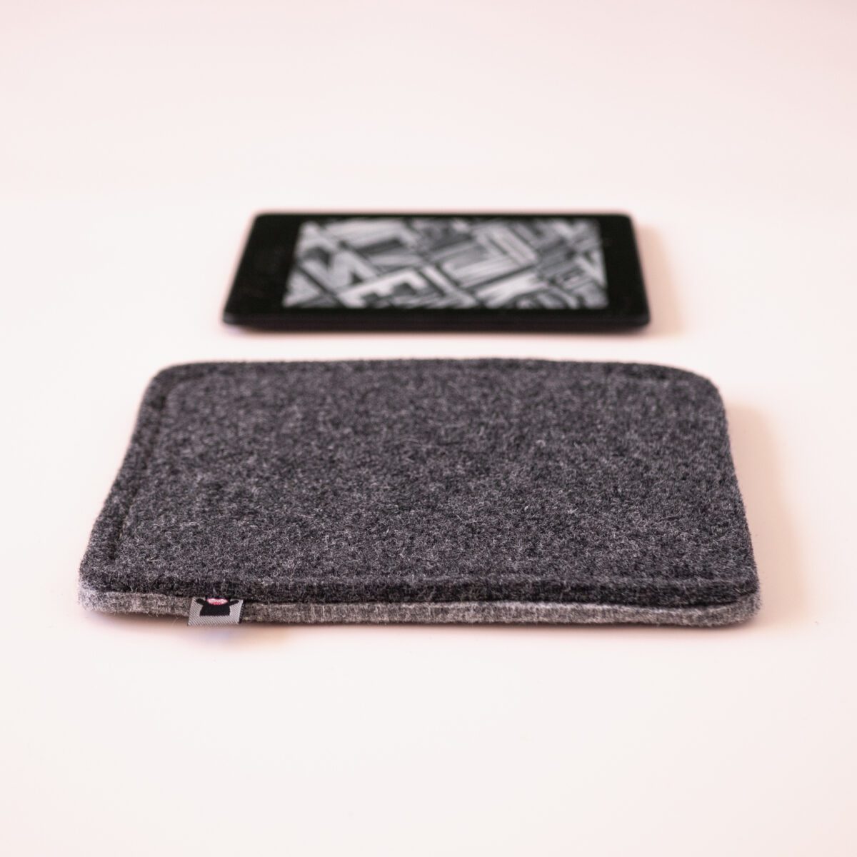 Kindle case made of black and dark gray wool felt