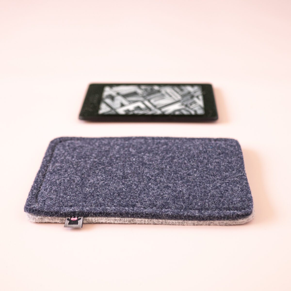 Kindle case made of navy blue and light gray wool felt