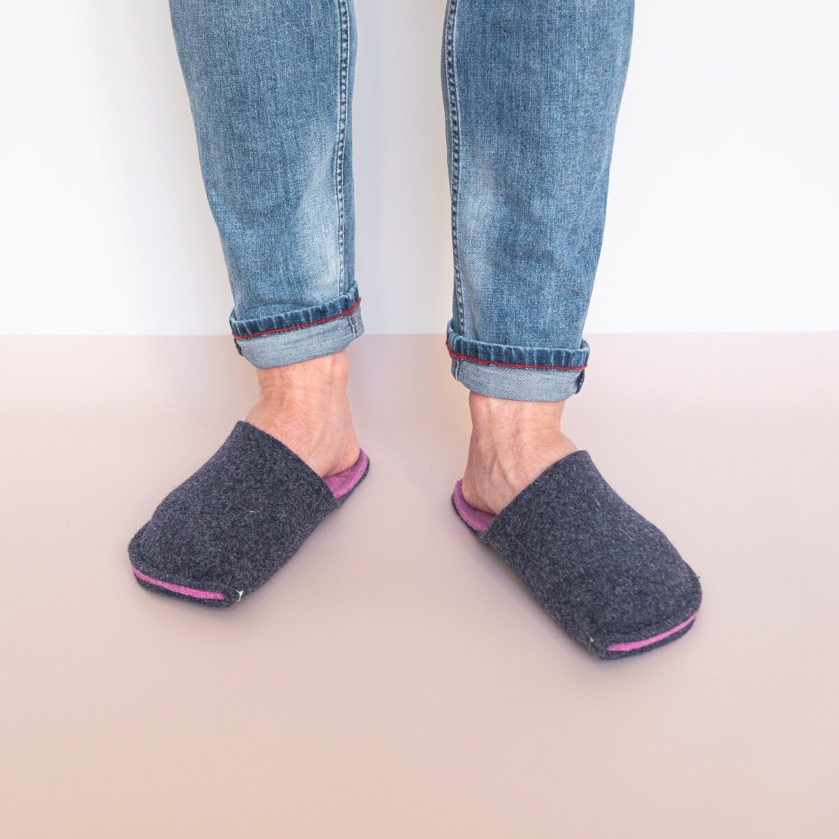 A man wearing navy Blue and Orchid Purple Slippers