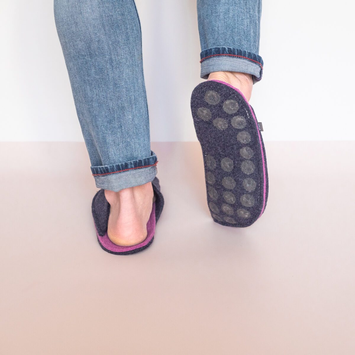 A man wearing navy Blue and Orchid Purple Slippers