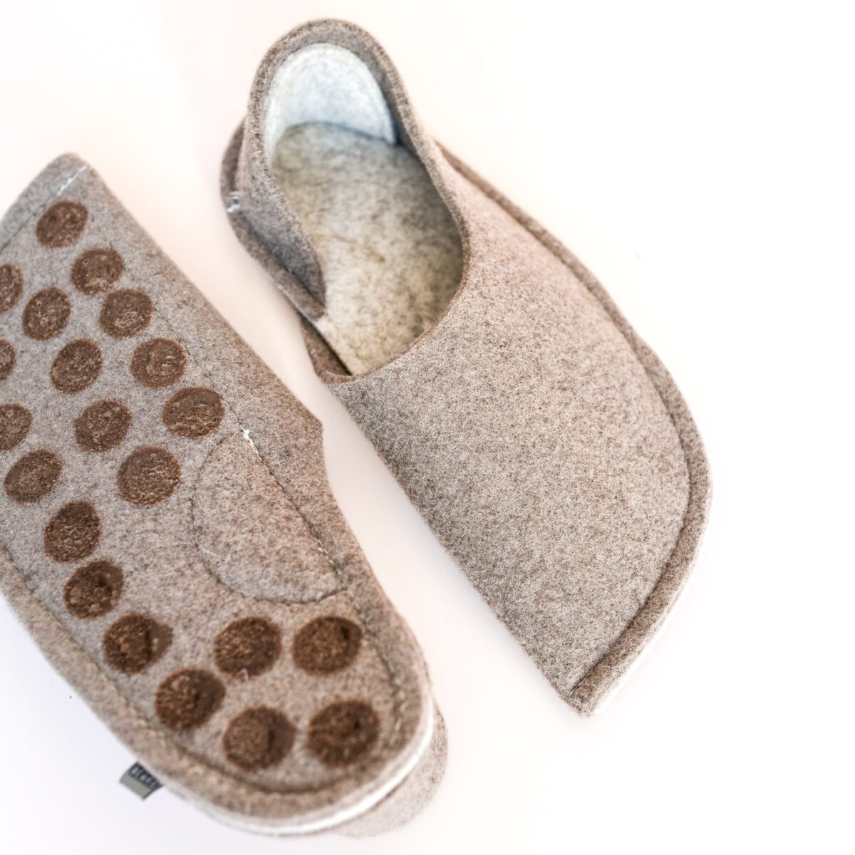 Grayish brown and cream white house slippers with closed back