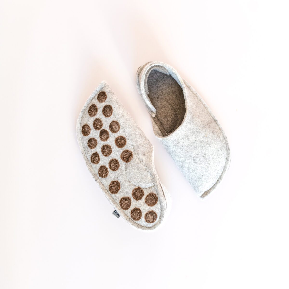 Cream white and grayish brown house slippers with closed back