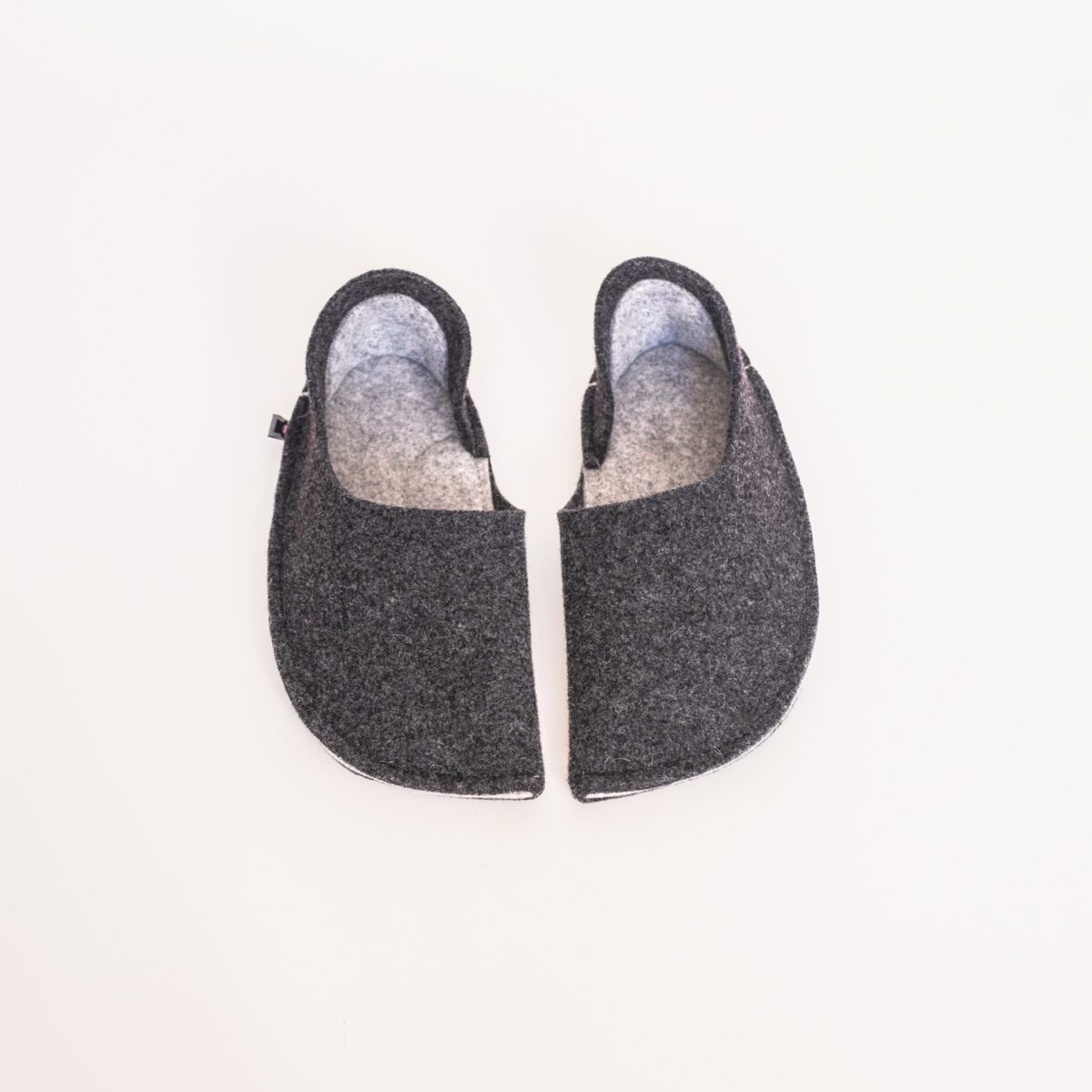 Black and light gray slippers with a closed back