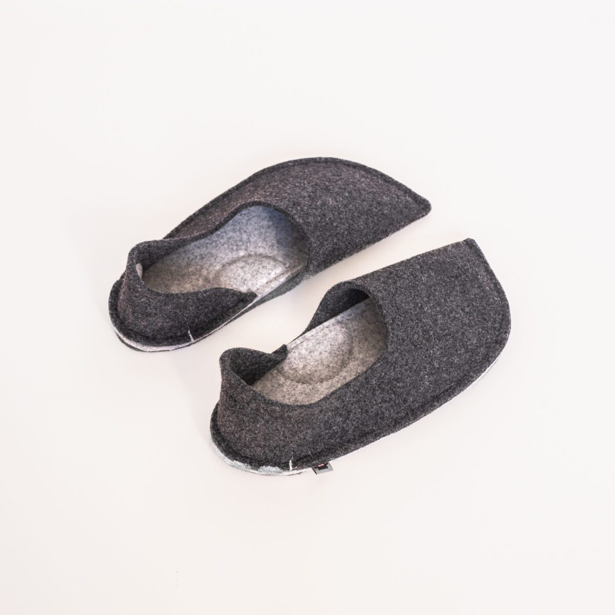 Black and light gray slippers with a closed back