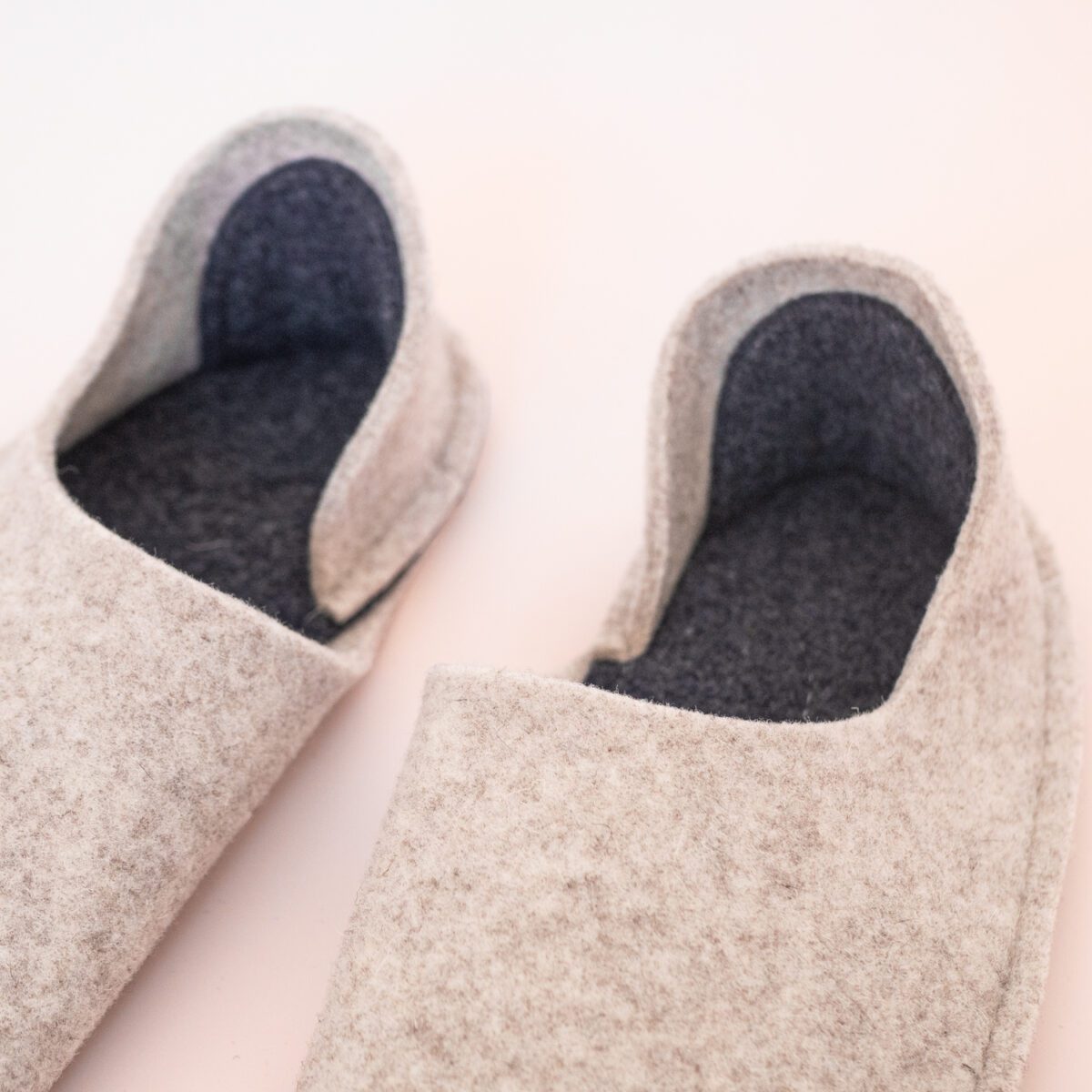 Cream white and navy blue slippers with a closed back